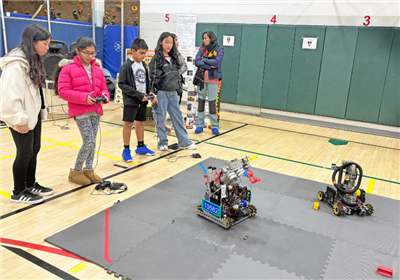  students working with robot